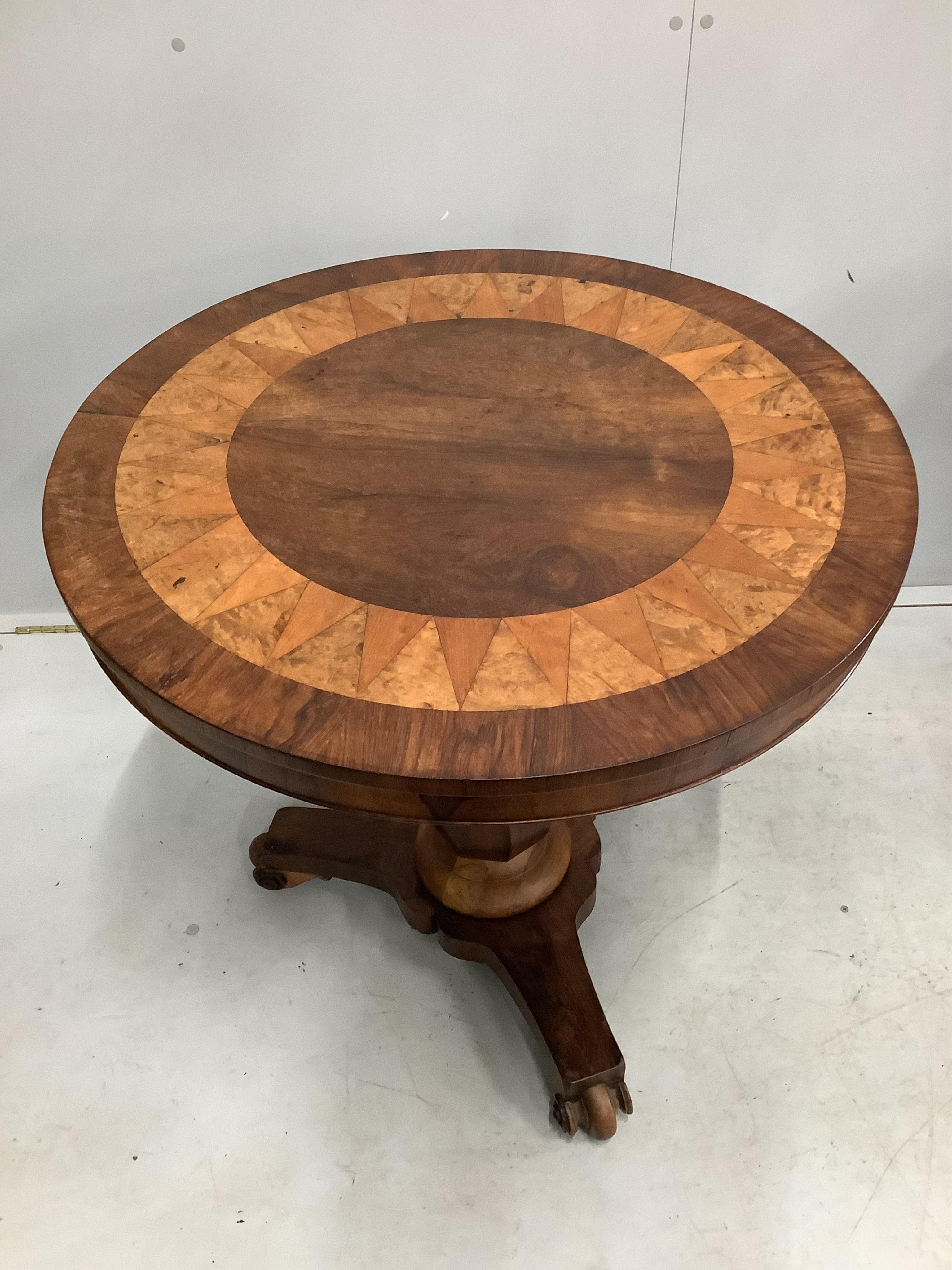 An early 19th century Continental rosewood, walnut and satinwood centre table, with parquetry top, diameter 76cm, height 75cm. Condition - fair to good